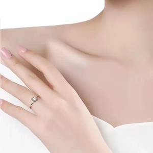 Moissanite S925 sterling silver snowflake ring on finger with bright round cut diamond