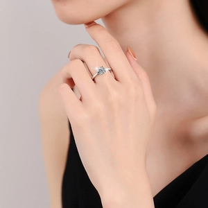 Classic S925 sterling silver moissanite ring with four-prong setting worn by a model