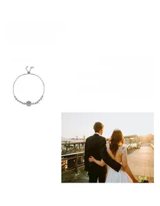Detail of Moissanite star and moon bracelet in S925 silver with a lifestyle wedding backdrop