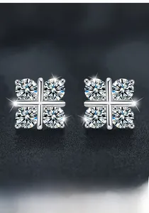 Macro view of S925 silver four-leaf clover moissanite stud earrings with a four-prong setting