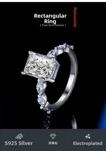 Macro detail of S925 sterling silver ring with rectangular moissanite stone and side diamonds