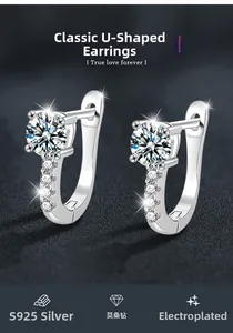 Macro detail of S925 silver U-shaped earrings featuring brilliant moissanite stone settings