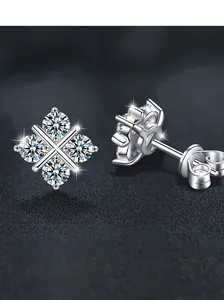 Macro shot of S925 sterling silver four-diamond clover stud earrings on a dark base