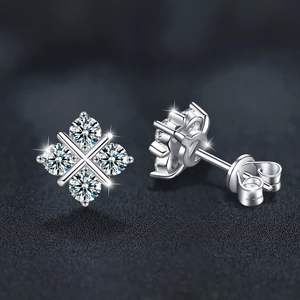 Elegant S925 sterling silver four-leaf clover moissanite stud earrings on leather