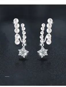 Detail of S925 silver star earrings with five pearls and 58-facet moissanite cut