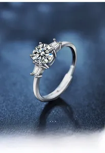 Macro shot of S925 sterling silver moissanite ring with six-prong setting and side stones