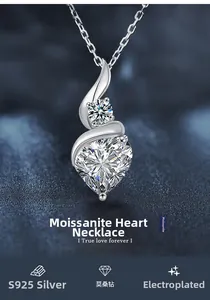 Close-up of S925 sterling silver heart-shaped moissanite necklace on blue velvet