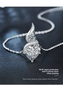 Macro view of heart-cut moissanite pendant necklace on premium blue leather texture