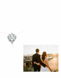 Macro-opname van hartgeslepen moissaniet hanger aan een minimalistische zilveren ketting
