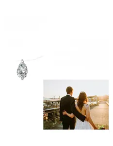Detail of pear-cut moissanite teardrop pendant on a clear invisible fishing line necklace