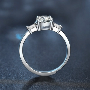 Three-stone s925 silver ring with a large round moissanite and baguette side stones