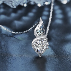 Elegant S925 sterling silver heart-shaped moissanite pendant necklace on a dark background