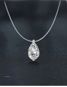 Macro shot of 58-facet teardrop moissanite pendant on a clear fishing line chain