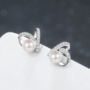 Elegant S925 sterling silver freshwater pearl stud earrings with zircon heart-shaped accents
