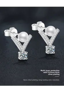 Macro detail of V-shaped S925 silver pearl earring with nano-plating technology finish