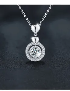Macro detail of S925 sterling silver heart pendant with 3EX round cut moissanite stone