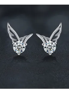Macro shot of 925 silver angel wing earrings featuring 3EX cut moissanite stones