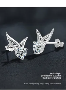 Close-up of S925 sterling silver angel wing stud earrings with moissanite center stone