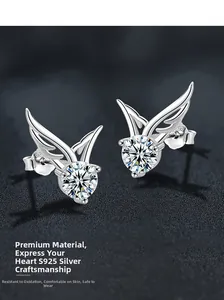 Macro close-up of S925 sterling silver angel wing earrings with sparkling moissanite stones