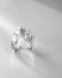 Detail of S925 sterling silver moissanite couple rings with star engraving and stone setting