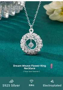 Macro view of S925 sterling silver dreamcatcher pendant with moissanite on green velvet