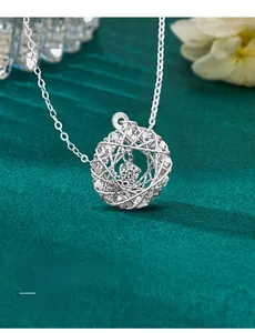 Macro side view of S925 sterling silver dreamcatcher necklace with moissanite center stone