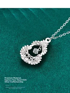 Macro detail of S925 sterling silver hollow heart necklace with sparkling center stone