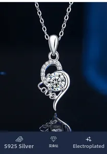 Macro shot of S925 sterling silver heart necklace with moissanite center and love engraving