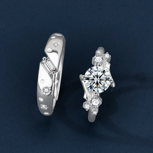 Minimalist S925 sterling silver couple rings set with moissanite stones on blue texture