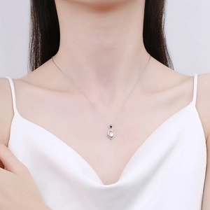 S925 sterling silver heart necklace with sparkling moissanite on female model
