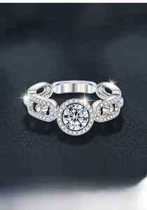 Macro shot of S925 silver moissanite ring with halo setting and chain-link band detail