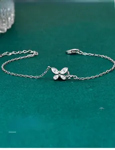 Detailed macro shot of S925 silver butterfly bracelet with 3EX cut moissanite stones