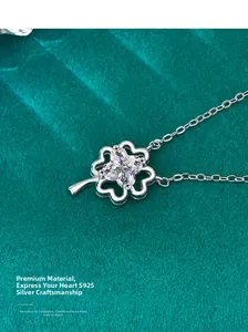 Close-up of S925 sterling silver four-leaf clover pendant with sparkling moissanite stone