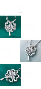 Macro detail of Moissanite clover pendant showing princess cut and 4-prong setting