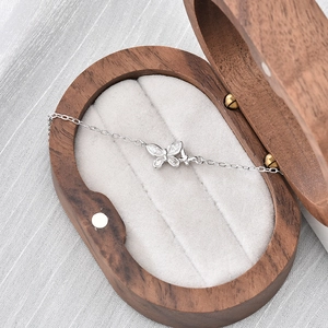 Elegant S925 sterling silver butterfly bracelet with sparkling crystals in a wooden box