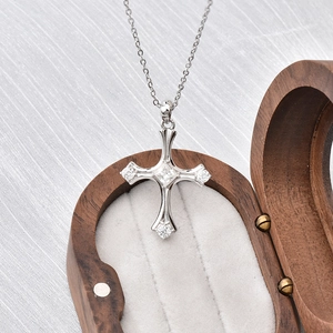 S925 sterling silver cross necklace with moissanite pendant on a luxury wooden gift box