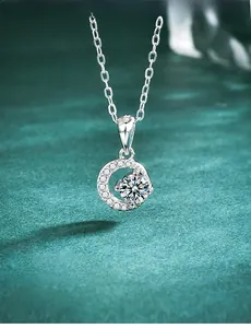 Macro view of S925 sterling silver crescent moon pendant with brilliant moissanite stone