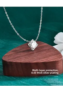 Detail of Moissanite square pendant on a wooden heart stand with nanometer color preservation
