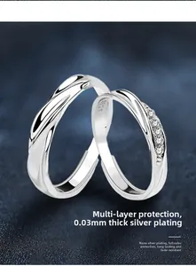 Detailed macro view of S925 sterling silver couple rings with polished textured finish