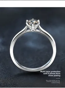Macro shot of silver ring featuring classic six-prong setting with clear round diamond