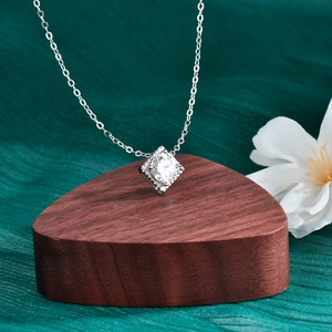 Minimalist S925 sterling silver square moissanite pendant necklace on wooden display