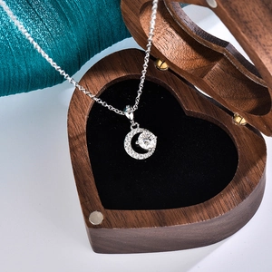 Elegant S925 sterling silver moon necklace with moissanite pendant in a heart-shaped box