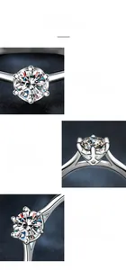Detail view of silver ring showing classic four-prong moissanite setting and polished finish