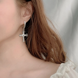 925 silver cross dangle earrings with sparkling moissanite stones on female model