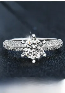 Macro shot of S925 sterling silver ring with six-prong moissanite and micro-pave diamonds