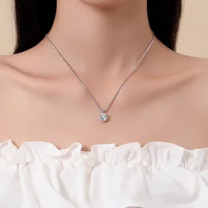 Elegant 925 silver necklace with sparkling round moissanite pendant on female model