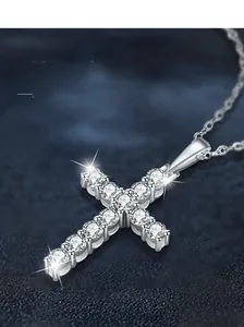 Macro detail of S925 sterling silver cross pendant with sparkling moissanite stones