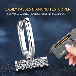 U-shaped 925 sterling silver earrings with moissanite stones passing diamond tester