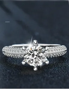 Detailed view of 3EX cut moissanite ring with 58 facets and 925 silver pave band