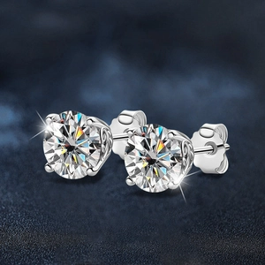 Classic moissanite four-prong silver studs with brilliant cut and hollow side patterns